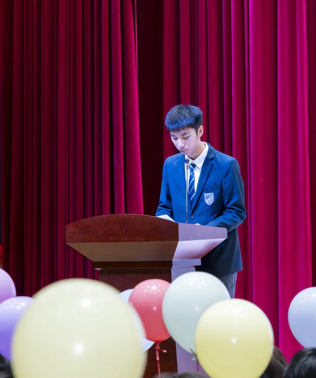 Daniel speaking at a ceremony