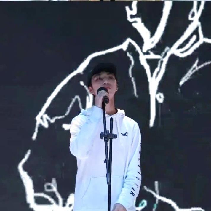 Daniel performing music on stage